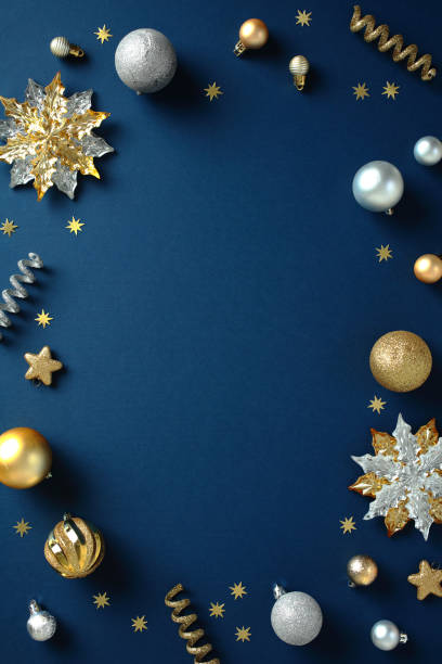 istock Elegant Christmas Vertical Background. Festive dark blue backdrop with golden and silver decorations, perfect for holiday marketing or seasonal designs 2188278494