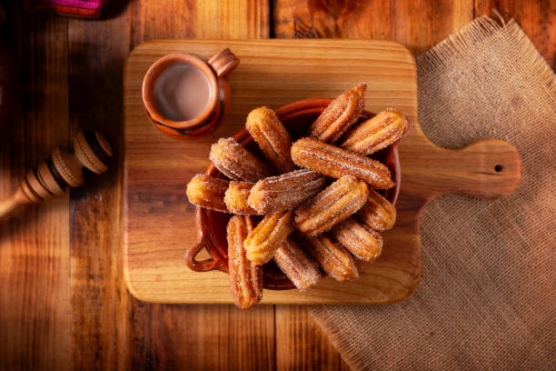 istock homemade Churros and mexican hot chocolate table topview 2188280354