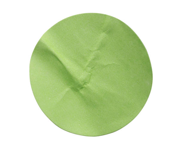 istock Blank green round adhesive paper sticker label isolated on white background 2188284120