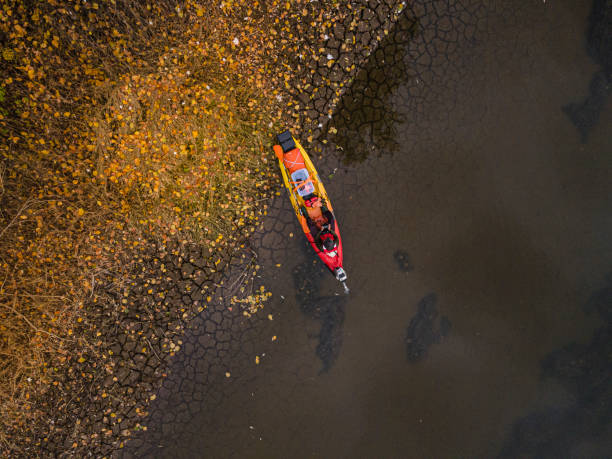 istock Explorer in Rainforest River on Autumn Kayaking Trip, Aerial View 2188284404