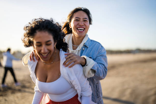 istock Joyful Hispanic Female Friends Bonding at Seaside 2188285799