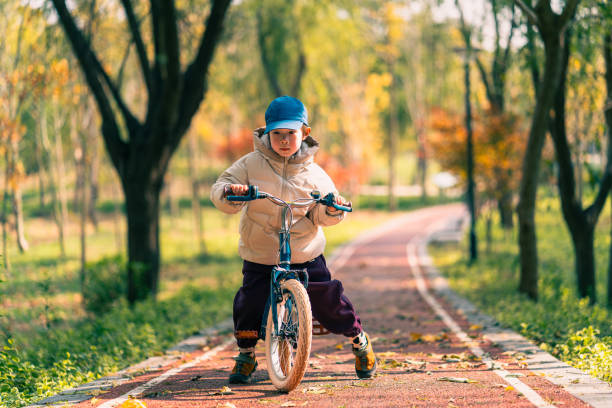 istock A little boy learns to ride a bike 2188285976