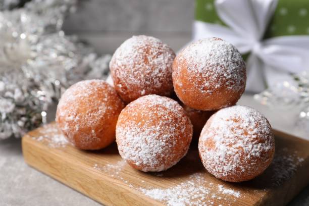 istock Delicious sweet buns with powdered sugar on table, closeup 2188286617