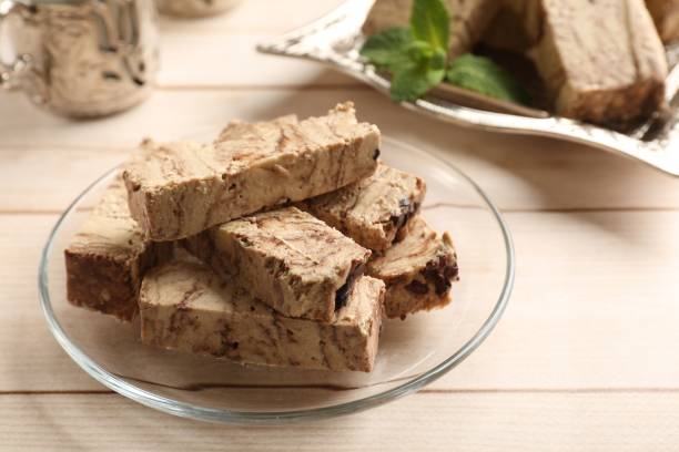 istock Tasty chocolate halva on wooden table, closeup 2188286721