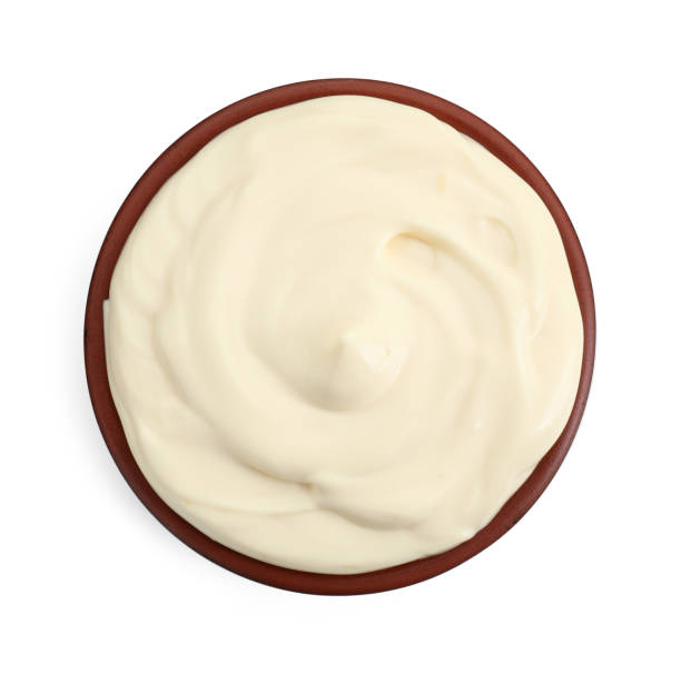 istock Fresh mayonnaise sauce in bowl isolated on white, top view 2188287026
