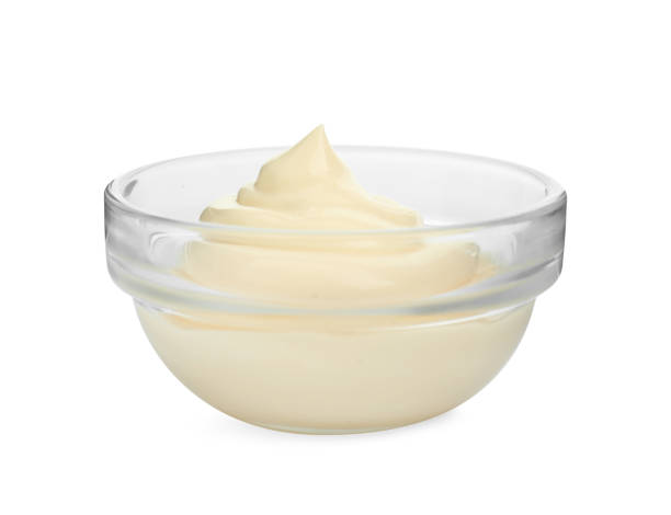 istock Fresh mayonnaise sauce in glass bowl isolated on white 2188287036