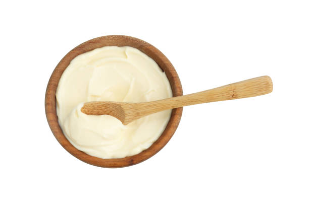 istock Bowl with mayonnaise sauce and spoon isolated on white, top view 2188287056