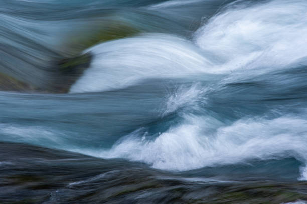 istock A long exposure photograph of flowing water that creates an abstract image. 2188287262