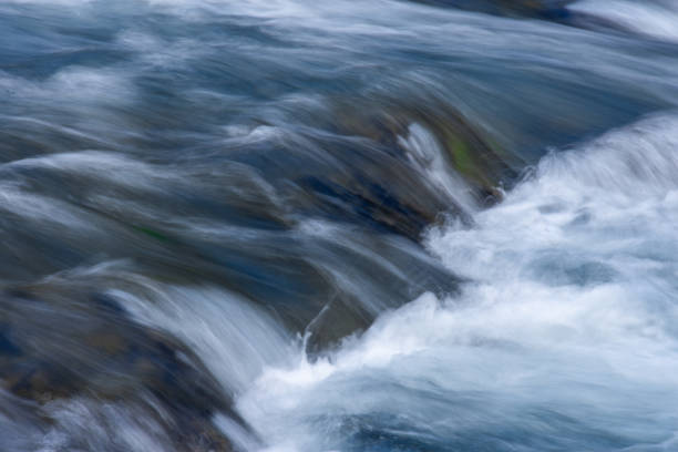 istock A long exposure photograph of flowing water that creates an abstract image. 2188287297