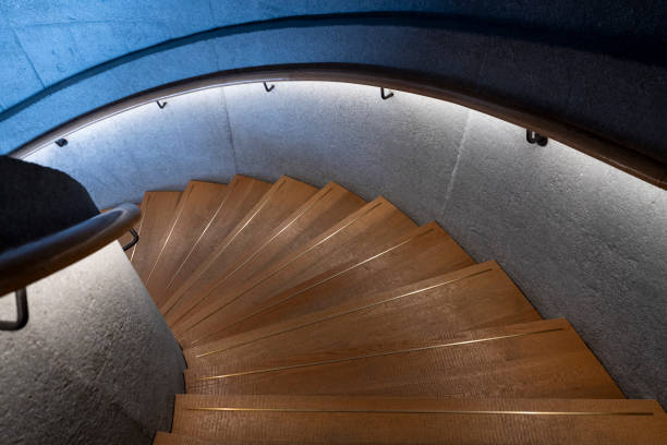istock Wooden and concrete spiral staircase 2188287687