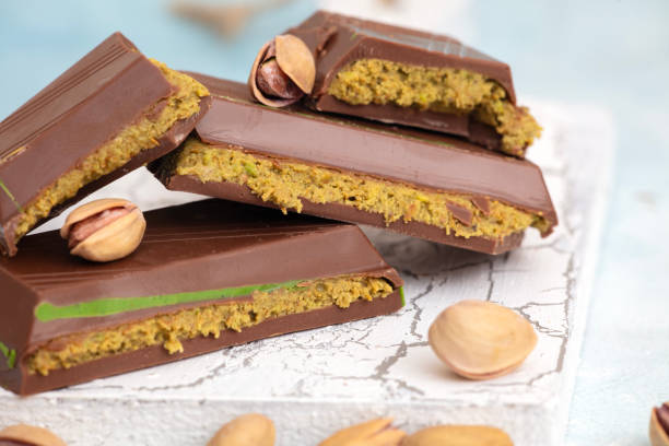 istock Dubai Chocolate bar with green kadayif and pistachio spread with pistachio nuts 2188293049