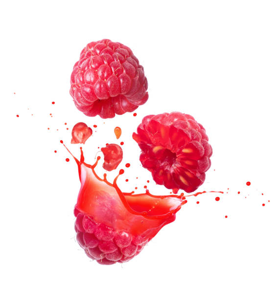 istock Whole and sliced raspberries with flowing juice close-up isolated on white background 2188293067