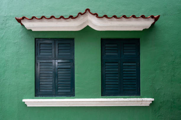 Vintage blinds on the green wall