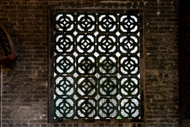 istock Vintage metal floral window on gray brick wall 2188295626