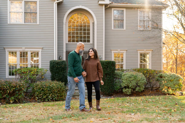 istock Multiracial couple in front of their house 2188296050