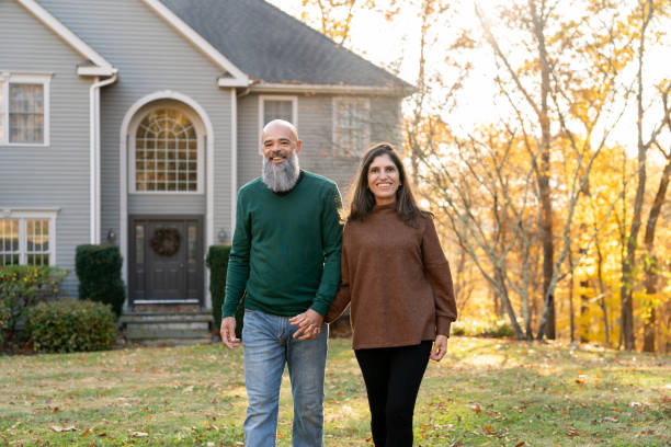 istock Multiracial couple in front of their house 2188296076