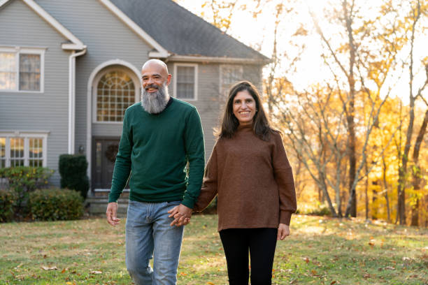 istock Multiracial couple in front of their house 2188296078