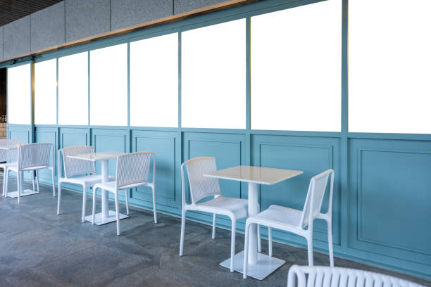 White tables and chairs outside the coffee shop