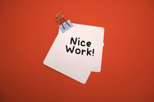 istock note card clipped with smile paper clip with handwritten 