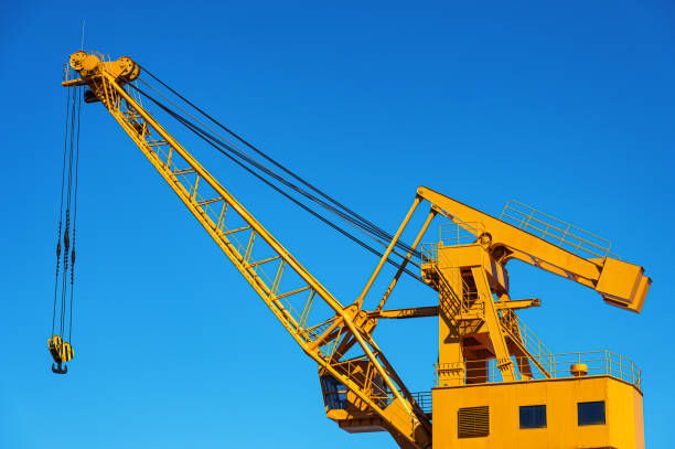 Large port crane with sunny blue sky background