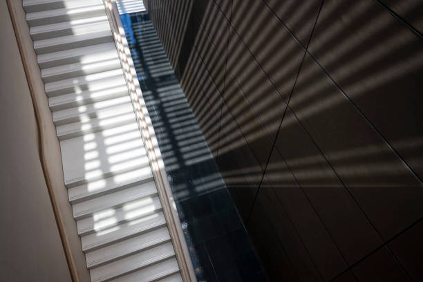 The lighting effect of the staircase shines on the wall
