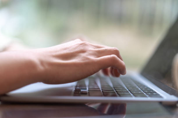 istock close up hand typing on keyboard of laptop 2188310444