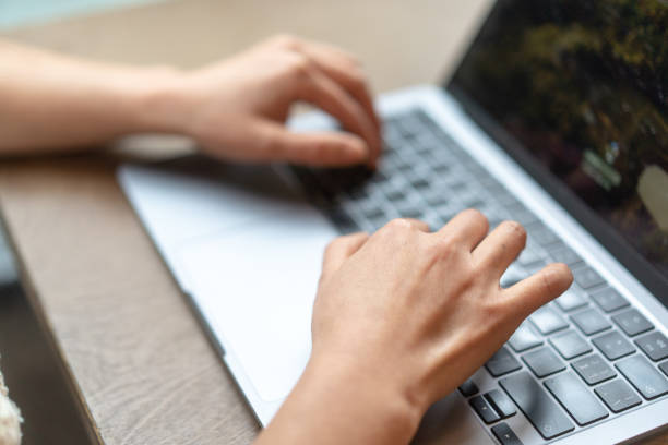 istock close up hand typing on keyboard of laptop 2188310445
