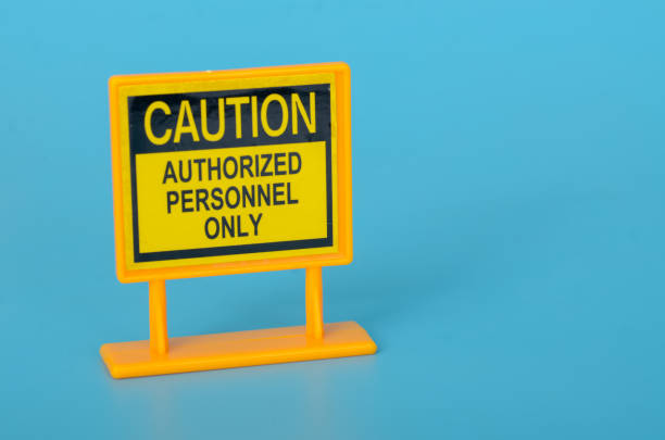 Attention Sign: Caution, Authorized Personnel Only - Safety Warning Board for Restricted Areas