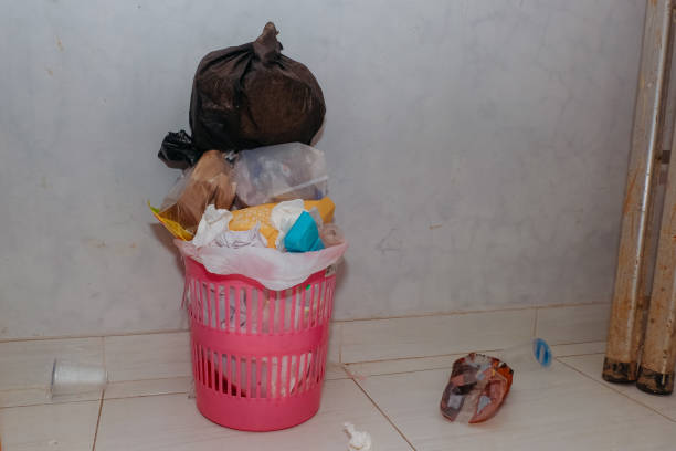 Discarded bottle and box. Domestic waste. Domestic trash bin full of recyclable waste. Hygiene.