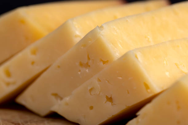 istock hard cheese with holes on the cutting board 2188311514