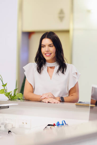 istock Businesswoman being greeted at reception 2188313693