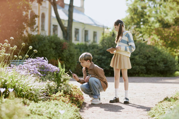 Teenagers Studying Plants In Local Park