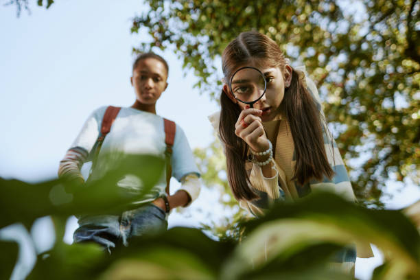 Friends Studying Plants In Botanical Garden