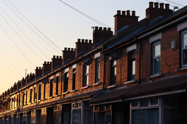 istock Row of old terraced houses illuminated by evening sunlight 2188316348