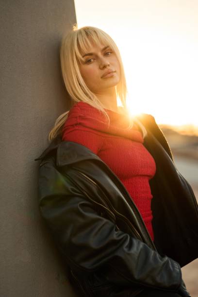 istock Ukrainian model leaning against wall at sunset 2188320347