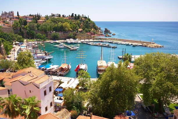 istock Mediterranean Harbor with Boats and Coastal Town under Sunny Blue Sky 2188321061