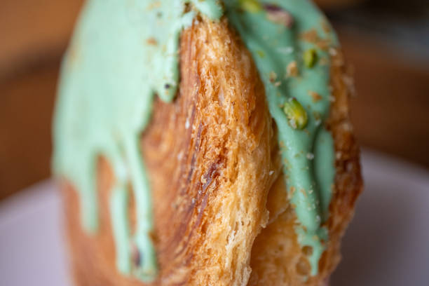Close-up round croissant new york roll with pistachio
