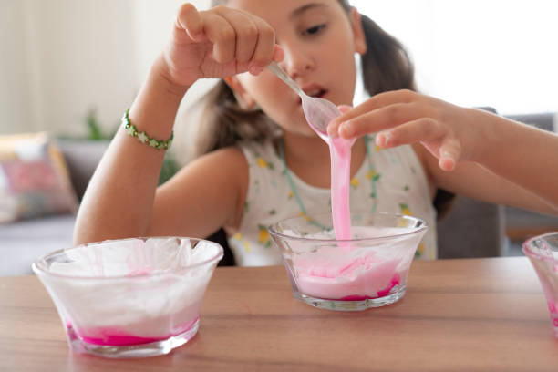 istock Girl playing with sticky slime 2188326760