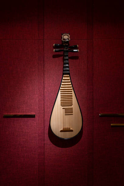 selective focus of an Iranian musical instrument called Santur in a dark room with low light
