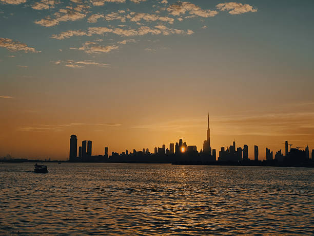 istock Twilight view of Dubai skyline from Creek Harbor, where city lights and reflections create a captivating scene of urban beauty and modern architecture. 2188328302