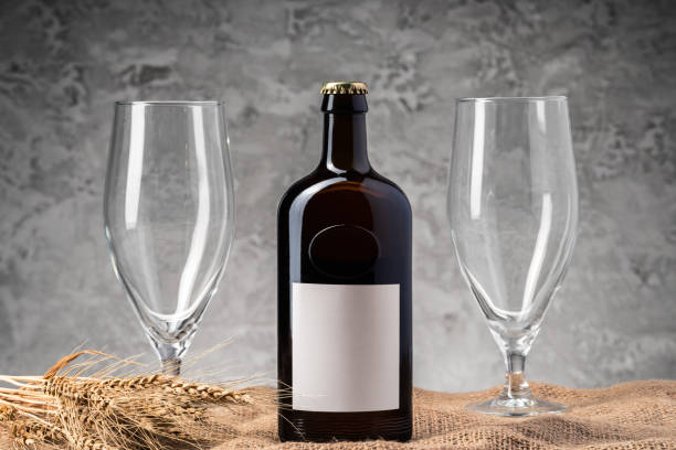 istock Beer bottle and beer glass against gray background 2188329208