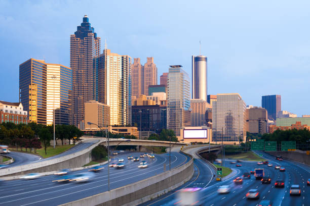 Cityscape Of Downtown Atlanta At Sunset With Traffic In The Freeway, Georgia, United States Photo taken in Atlanta, United States atlanta bridge stock pictures, royalty-free photos & images