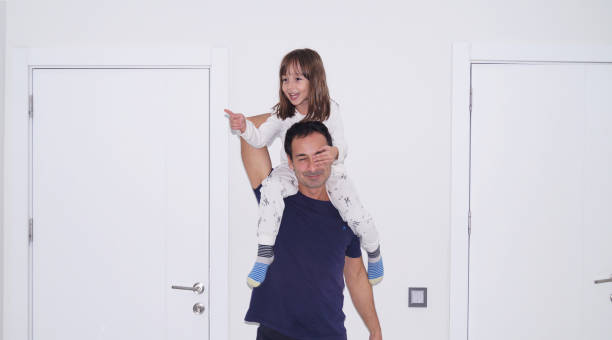 istock Dad carries his daughter on his back and having fun 2188330644