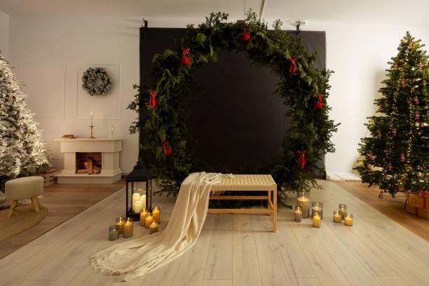 istock Cozy holiday interior with a decorated Christmas tree, wreath, and candles 2188333726