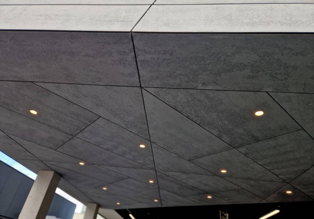 istock ceiling spotlights on the ceiling under the roof overhang. cement chipboard with joints in an industrial style, cetris 2188336146