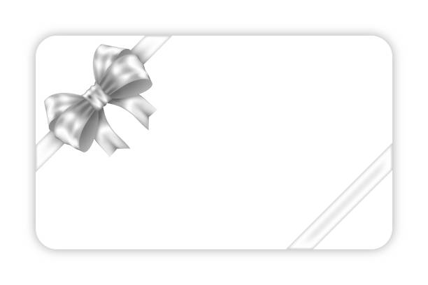 istock Mockup white gift card with two diagonal silver ribbon and silver bow isolated on white background 2188336516