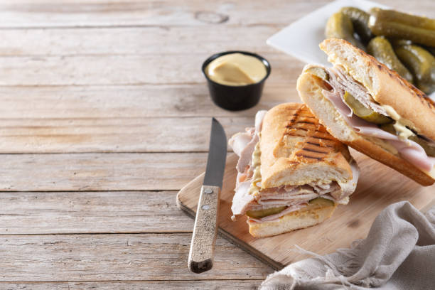 istock Traditional Cuban sandwich on wooden table 2188338021