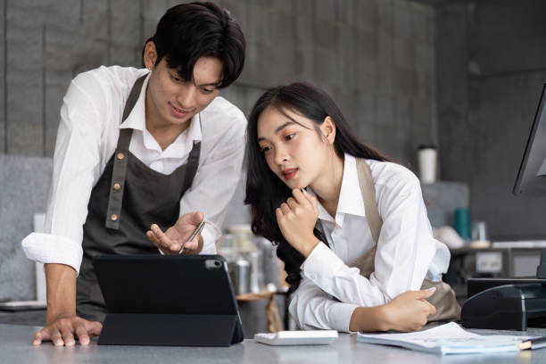 istock Young Entrepreneurs Collaborating in a Modern Office Environment with Digital Technology and Innovative Ideas 2188340438