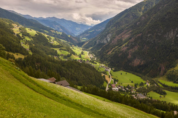 istock Grossglockner. Serpentine alpine road viewpoint. Green forest and valley. Austria 2188342298