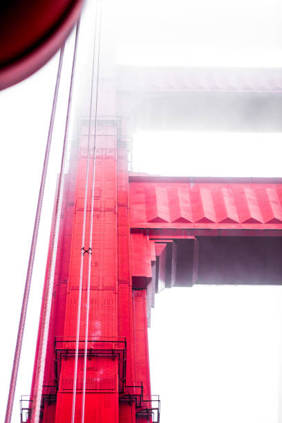 istock View of Iconic Golden Gate Bridge Tower Shrouded in Mist | Showcasing The Engineering Marvel Against a Foggy Backdrop in San Francisco, Highlighting Its Architectural Grandeur and Unique Design 2188346043